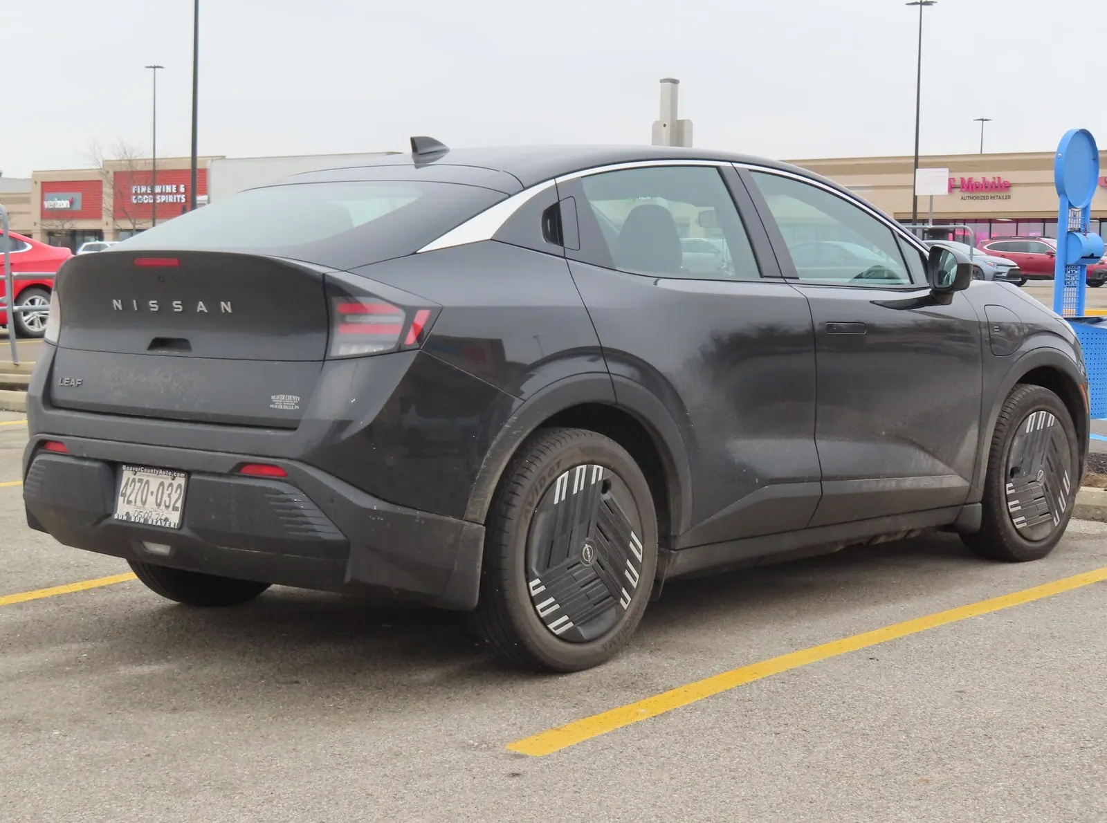 Black 2026 Nissan LEAF S+ viewed from the rear right on a parking lot in Pennsylvania